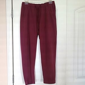 Under Armour, size  medium  wine colored capri pants.
